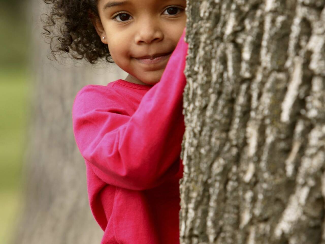 Girl behind tree Large